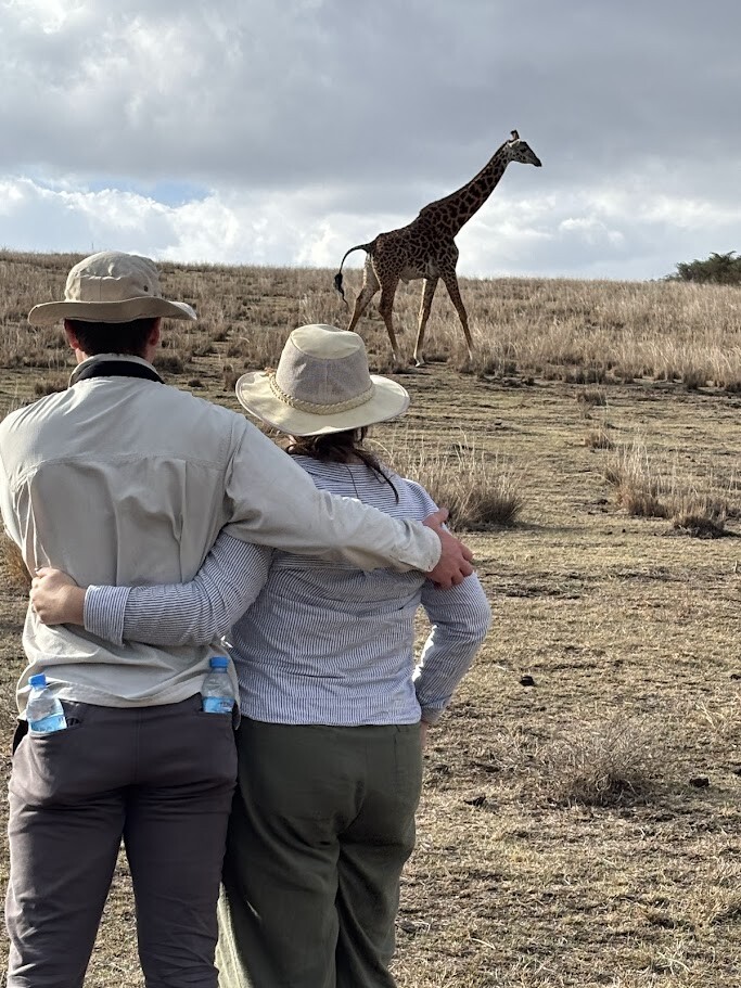 Ngorongoro Crater walking tour with a herd of giraffes nearby